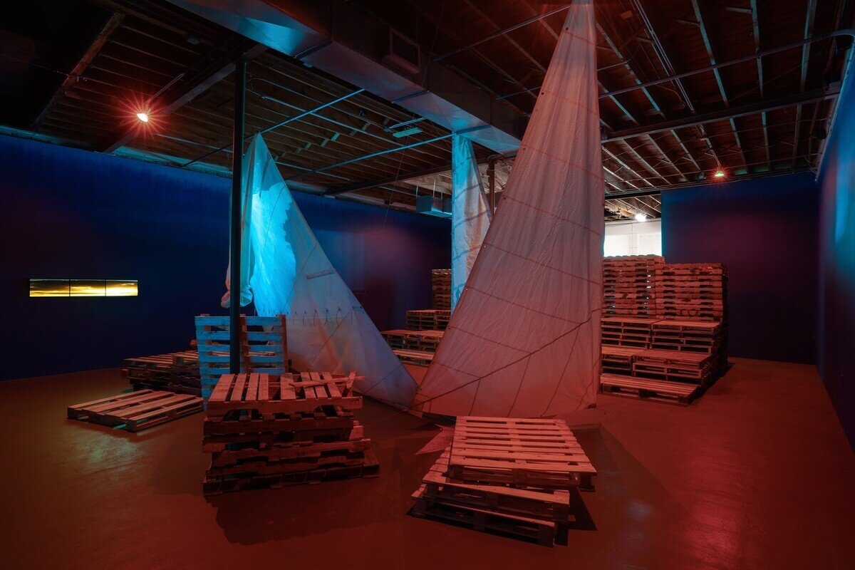 Video projection on suspended sails. Installation images courtesy of photographer Zachary Balber and Locust Projects